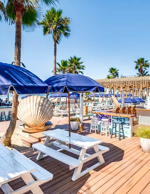 Tequila & Taqueria outdoor venue with blue umbrellas, perfect for summer parties and retreats.