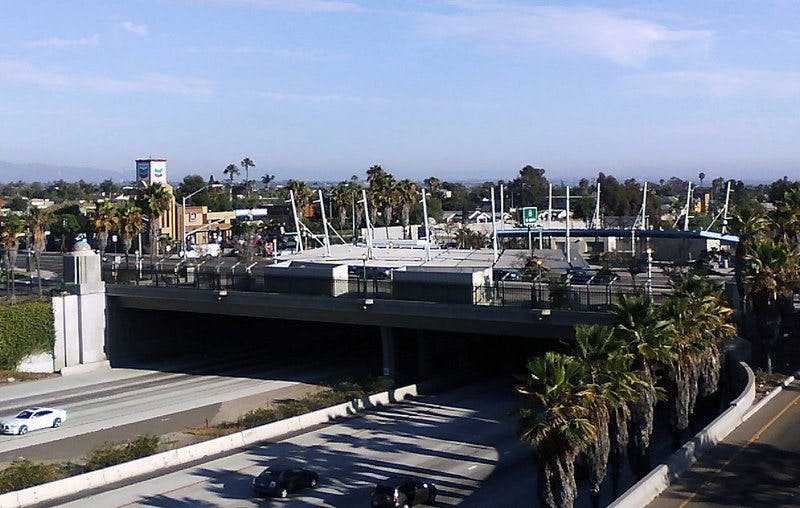 Vibrant outdoor venue in City Heights with palm trees, ideal for events and gatherings.