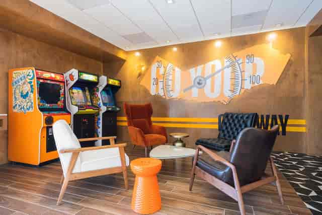 Retro Arcade lounge at The Rambler Motel with vibrant decor for team-building events.