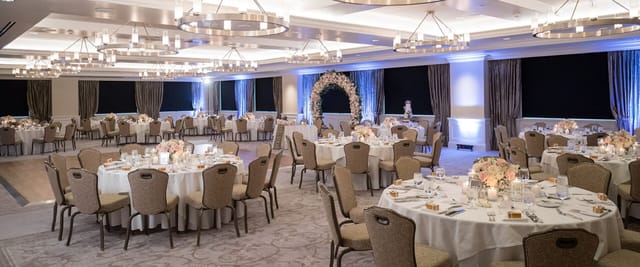 Elegant event space with floral centerpieces for weddings and formal gatherings.