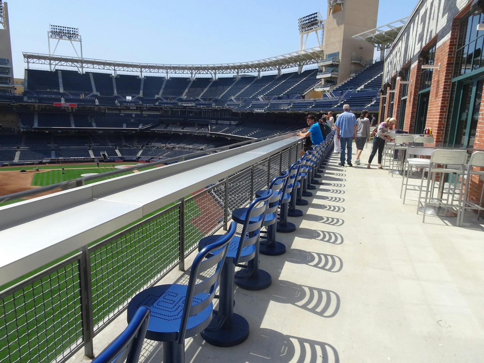 Outdoor event space with blue chairs at Petco Park for networking receptions.