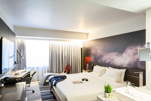 Modern hotel room at Novotel London Tower Bridge, ideal for business travelers and meetings.