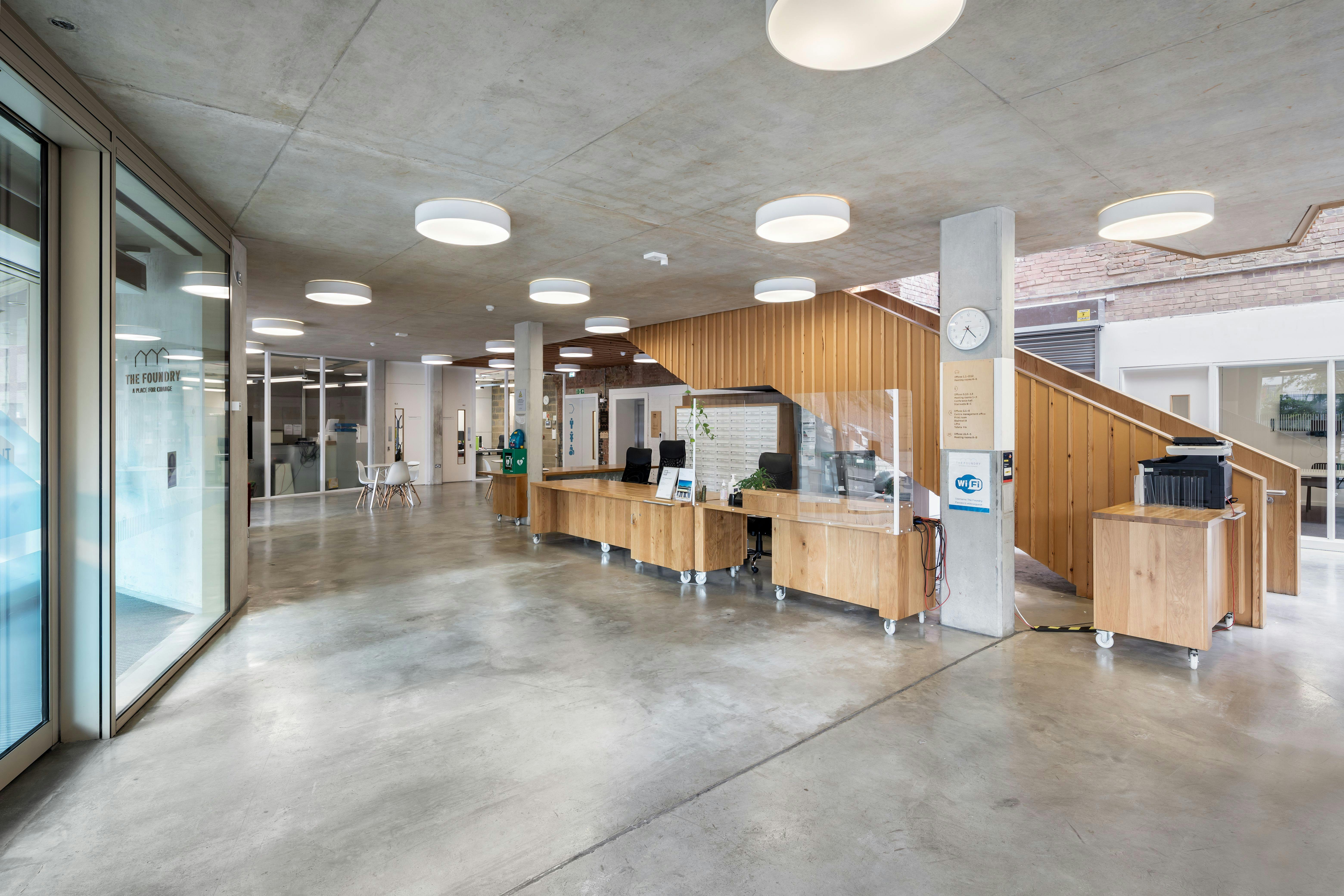 Modern meeting room lobby with natural light, ideal for events and networking.