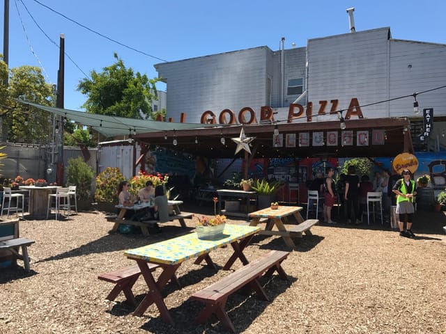 Vibrant Beer Garden at All Good Pizza, perfect for casual gatherings and events.