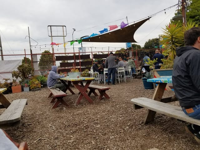 Vibrant Beer Garden at All Good Pizza, perfect for casual gatherings and team-building events.