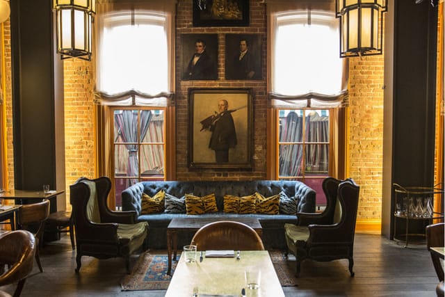 Stylish private lounge with plush seating, perfect for networking events and meetings.