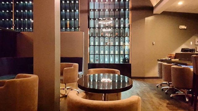 Private lounge with plush seating, ideal for cocktail receptions and networking events.