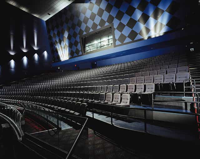 IMAX theater auditorium with tiered seating for conferences and presentations.