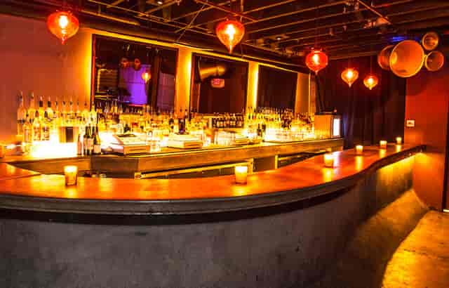 Stylish cocktail bar with warm lighting, ideal for networking events in MONARCH SF.