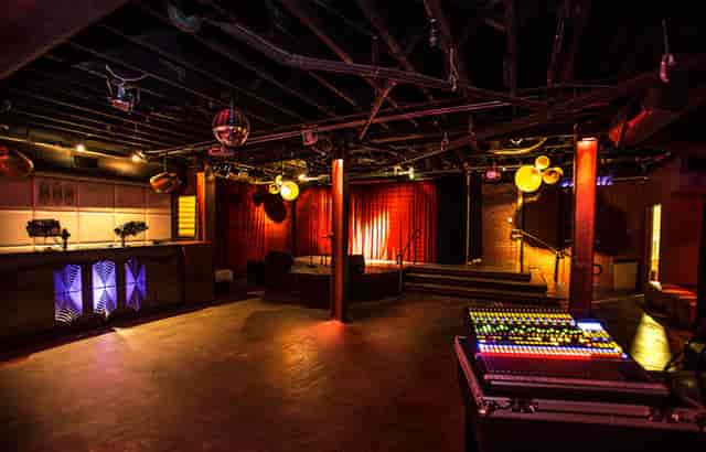 Main-floor Cocktail Bar in MONARCH SF with stage, ideal for events and gatherings.