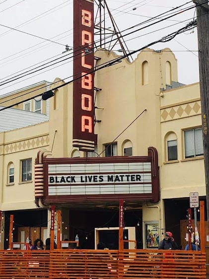 Balboa Theatre marquee with "BLACK LIVES MATTER" for social justice events.
