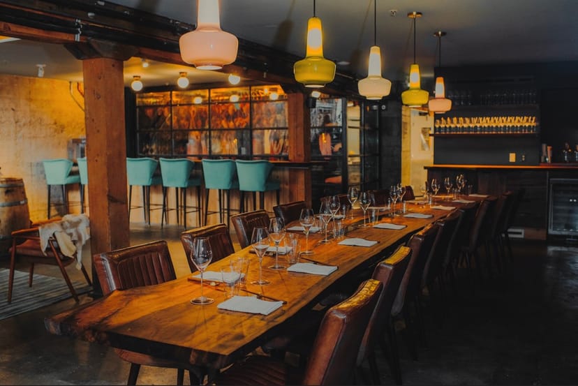 Stylish dining space with wooden table, ideal for corporate dinners and private events.