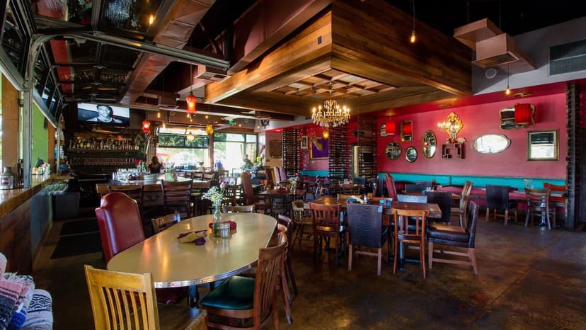 Main Dining Area at Flying Pig Bistro, vibrant decor for casual gatherings and events.