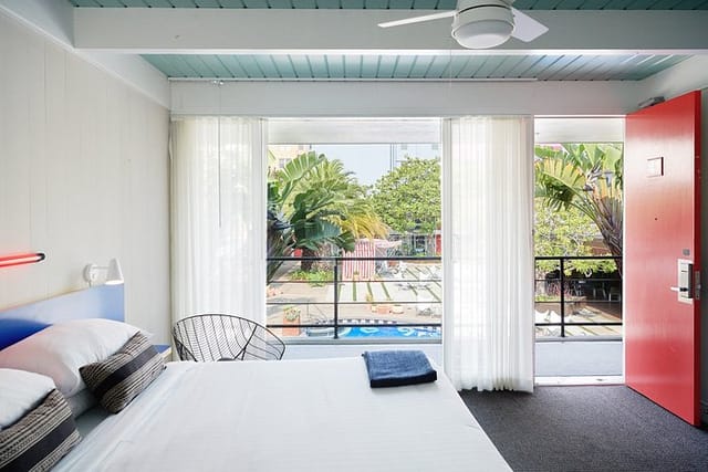 Vibrant hotel room with large windows, ideal for meetings and events in Phoenix.