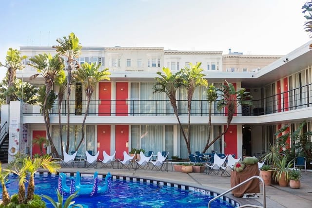 Vibrant hotel meeting space with pool, ideal for corporate retreats and social events.