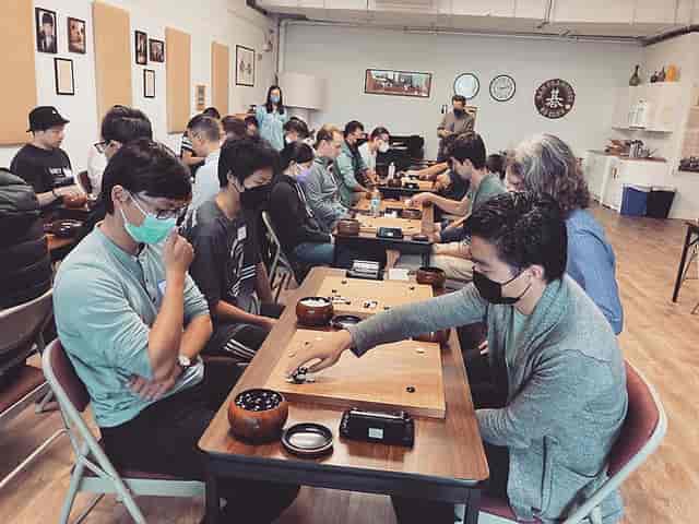 San Francisco Go Club tournament with masked players engaged in strategic gameplay.
