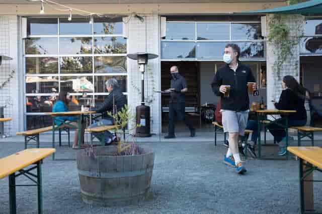 Beer garden at Splitrock Tap & Wheel with communal seating for casual events and gatherings.