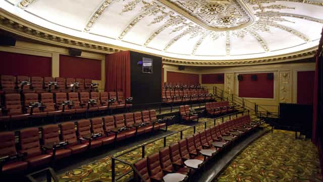 Alamo Drafthouse auditorium with plush seating for film screenings and corporate events.