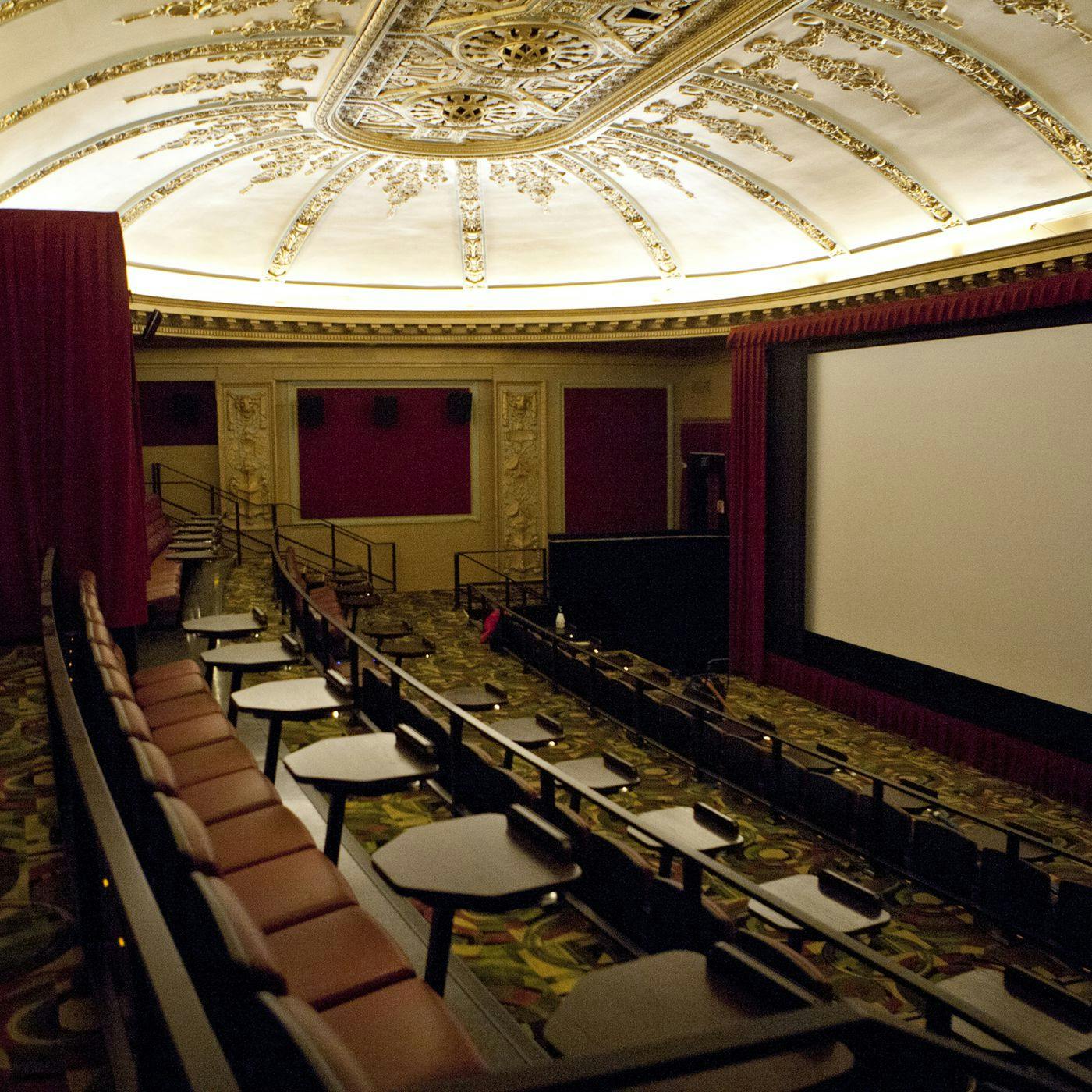 Vintage auditorium with tiered seating for film festivals and private events.