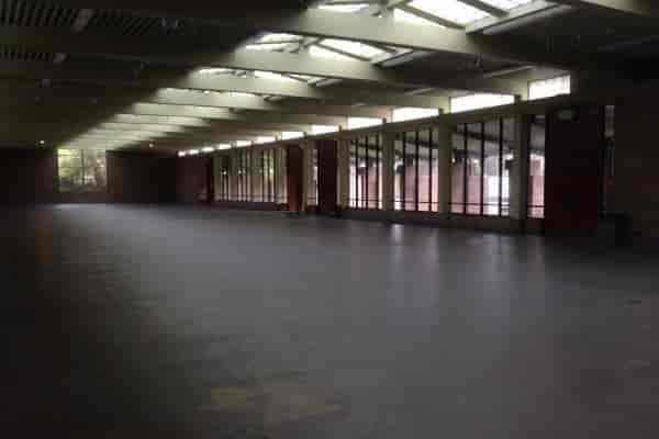 Spacious County Fair Building gallery with natural light, ideal for events and exhibitions.