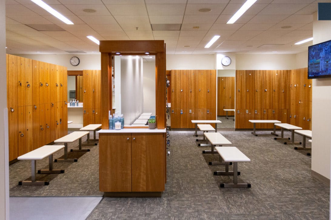 Galanter Family Aquatics Center locker room, warm wood tones, event space, guest comfort.