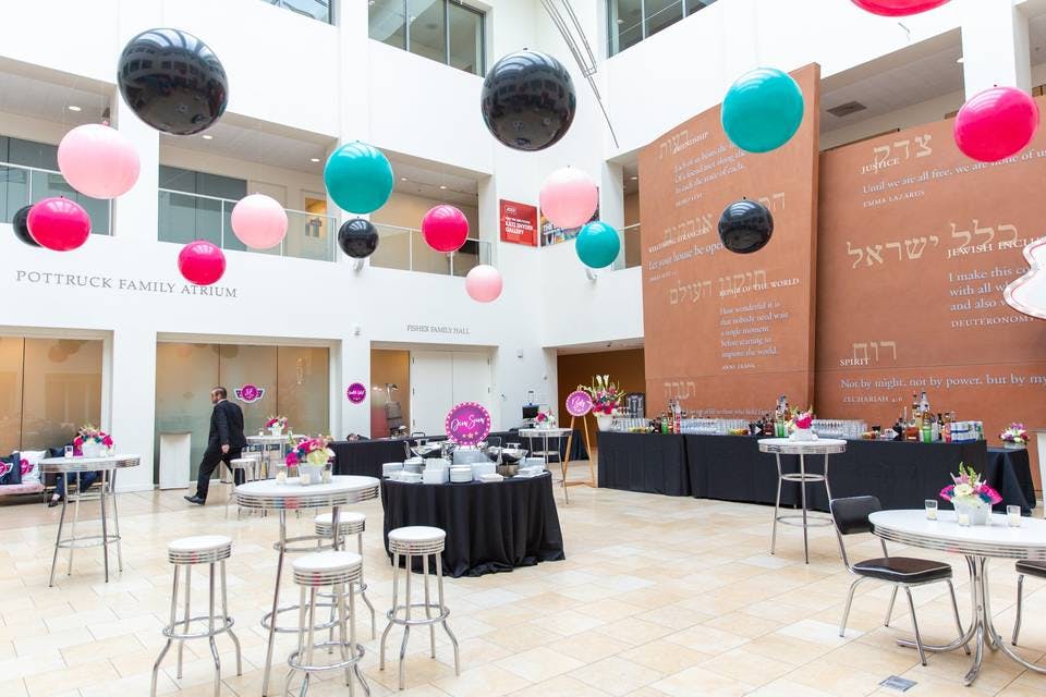 Jewish Community Center event space with colorful balloons for networking and celebrations.