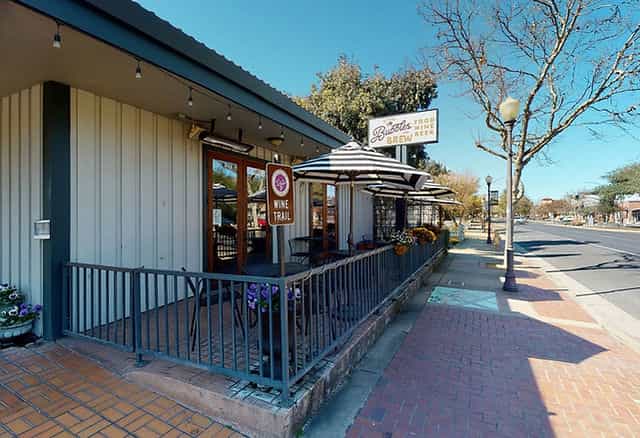 Charming outdoor beer garden venue for casual meetings and wine tastings.