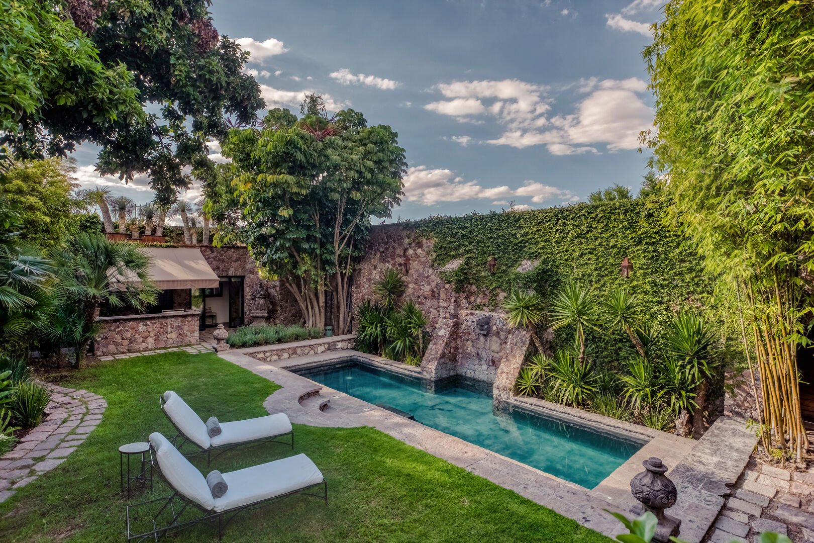 Private parties at Casa Villa with lush greenery and tranquil pool for intimate gatherings.