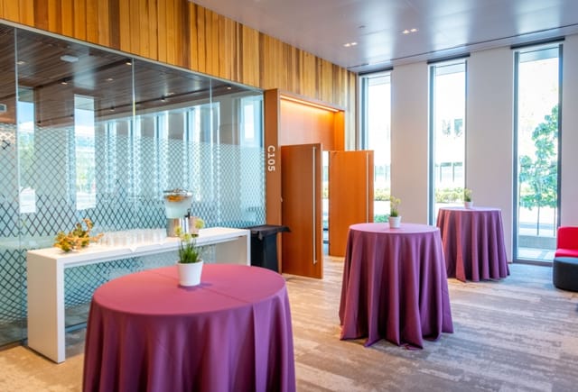 Modern Stanford conference center with round tables, perfect for networking events.