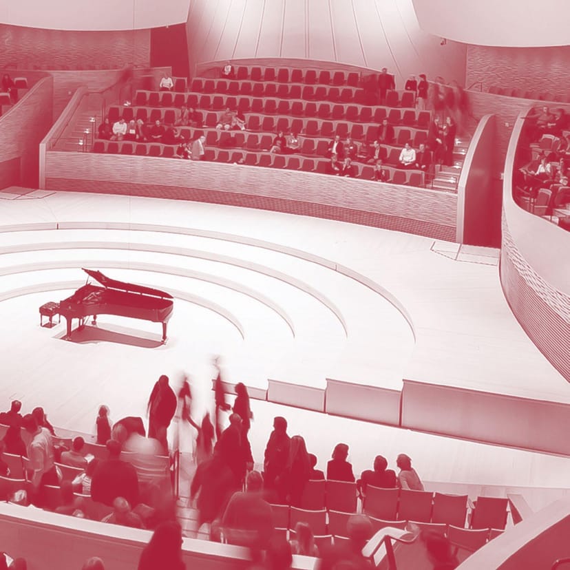 Modern auditorium with grand piano, ideal for concerts and conferences at Stanford Live.