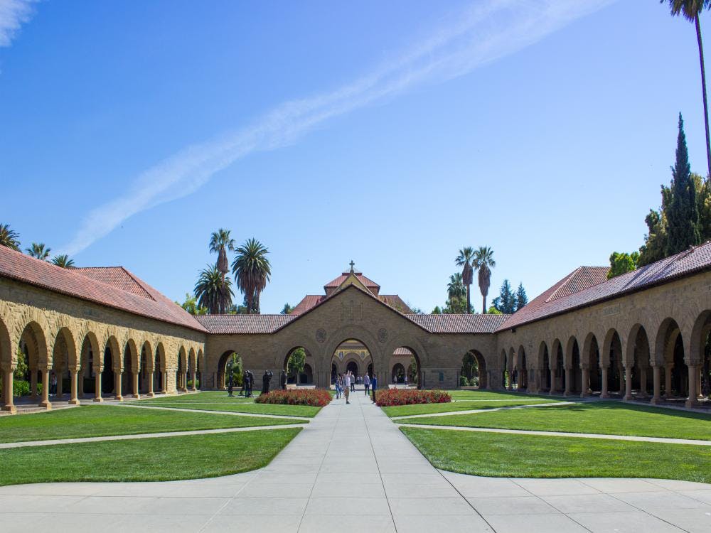 Stanford Main Quad courtyard with lush greenery, perfect for outdoor events and gatherings.