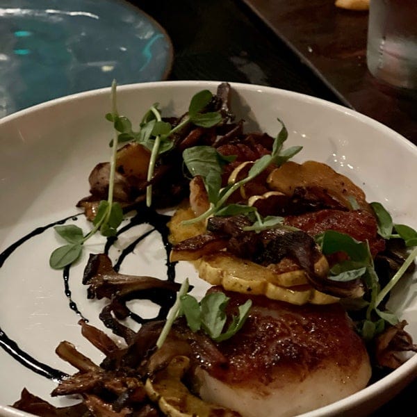 Upscale plated dish at Sidecar Bar & Lounge for gourmet dining event.