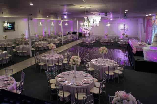 Elegant banquet hall with floral centerpieces, perfect for weddings and formal events.