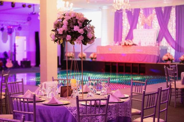 Elegant banquet hall with floral centerpieces, perfect for weddings and formal events.