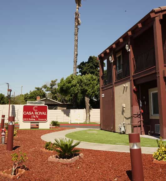 Casa Royal Inn San Jose exterior with welcoming signage for events and gatherings.