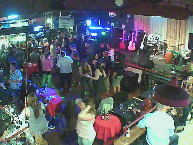 Karaoke stage at Quarter Note Bar & Grill, vibrant venue for parties and networking events.