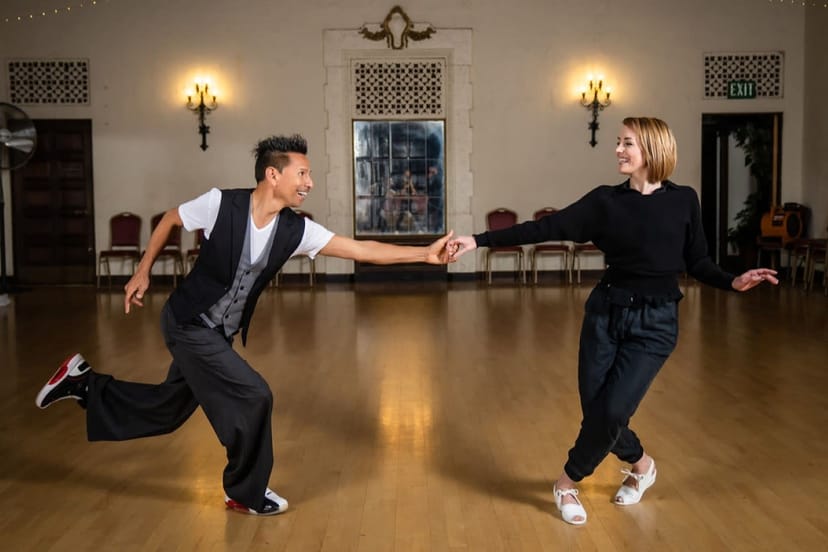 Dynamic dance partnership in Palomar Ballroom for engaging event experiences.
