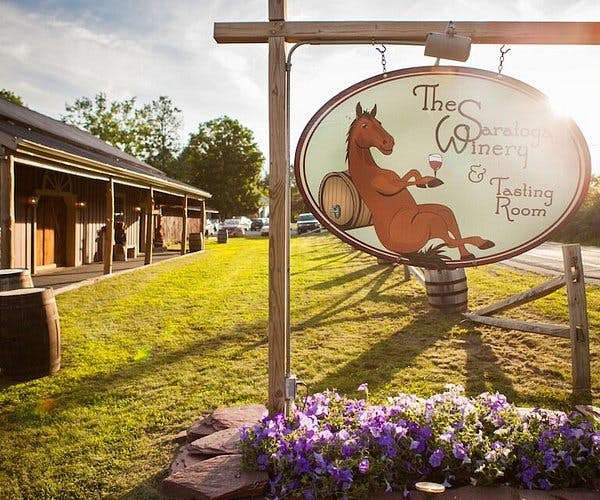 Charming Saratoga winery with horse sign, perfect for outdoor events and tastings.