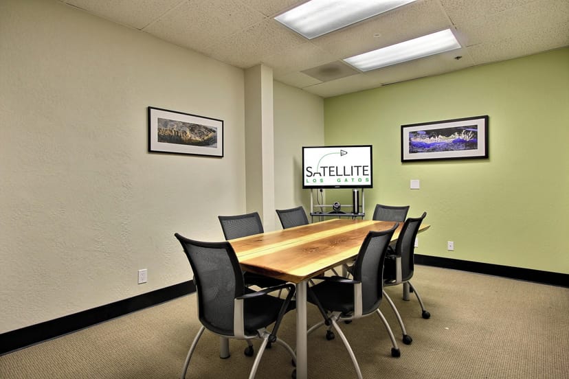Modern meeting room at Satellite Workplaces Los Gatos with ergonomic chairs for collaboration.