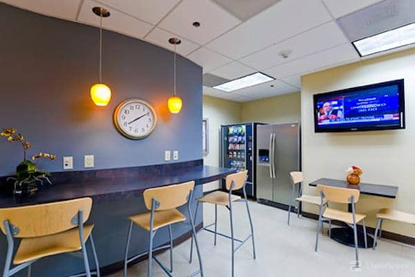 Modern break room in Legacy Hamilton Plaza for meetings and events with sleek counter.