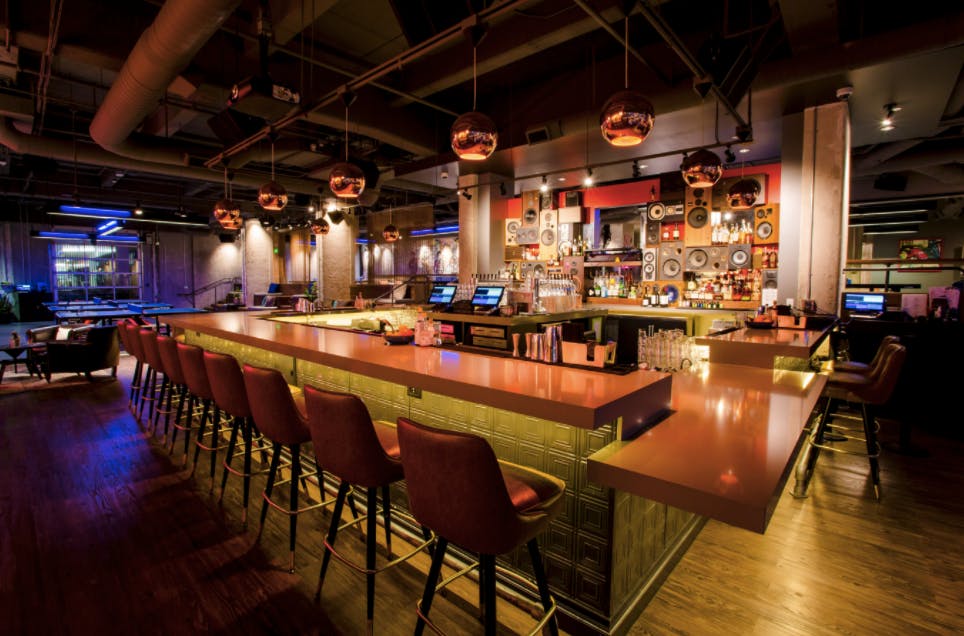 Stylish bar area at SPIN San Francisco, ideal for networking events and gatherings.
