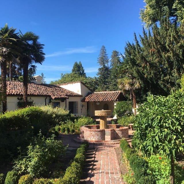 Board Room at Allied Arts Guild: serene outdoor venue with fountain for meetings and retreats.