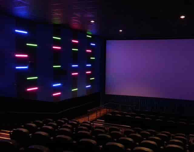 CineLux Almaden Café & Lounge with neon lighting, ideal for film screenings and events.