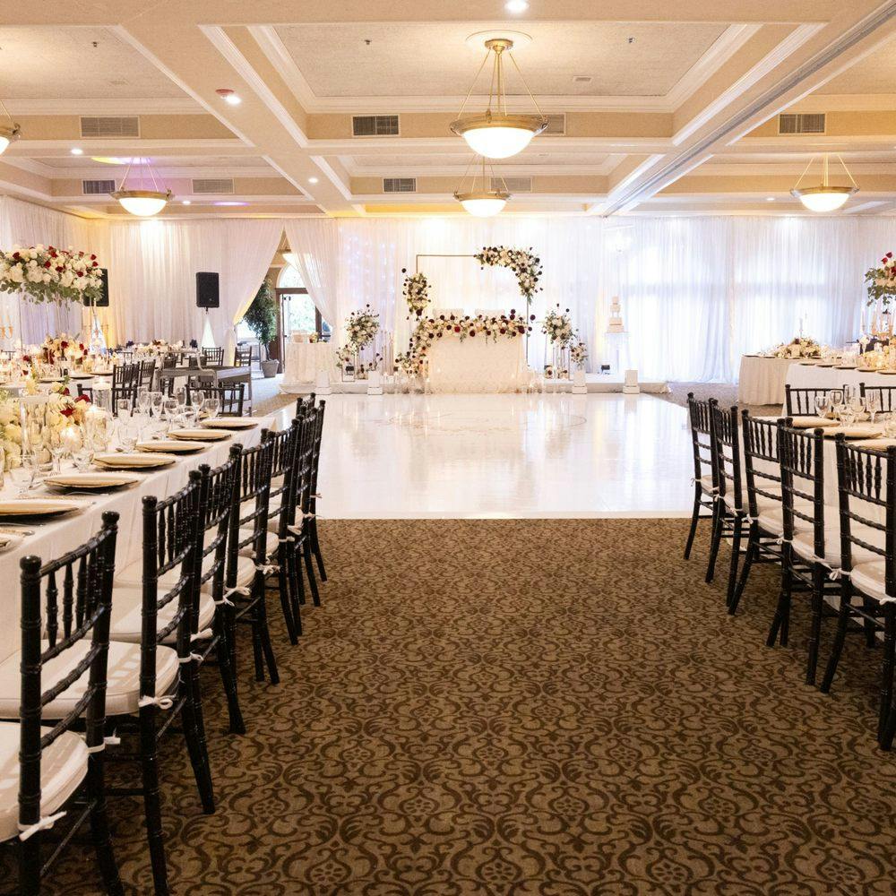 Elegant Coyote Ranch Community Hall with white drapery, perfect for weddings and events.