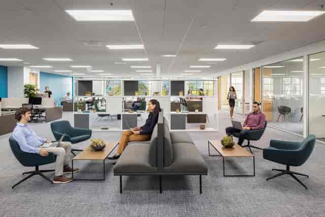 Modern meeting room with natural light and greenery for collaborative events.
