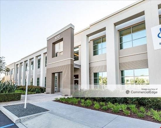 Modern meeting room with large windows, ideal for corporate events and workshops.