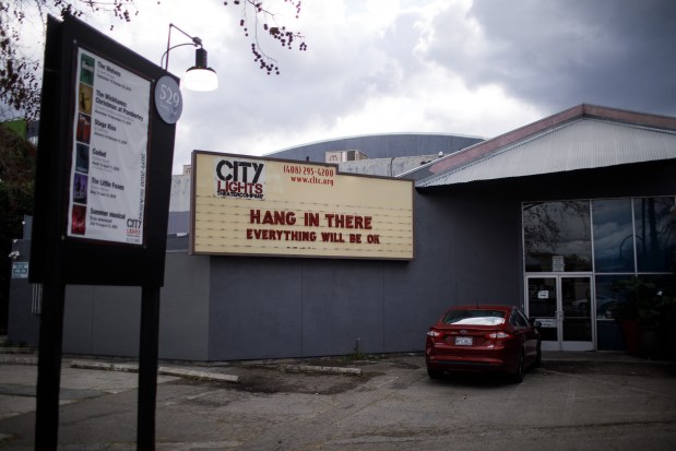 Outdoor patio at City Lights Theater with uplifting marquee for events and meetings.