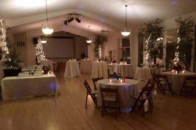 Beautiful garden event space with elegant tables, ideal for weddings and receptions.