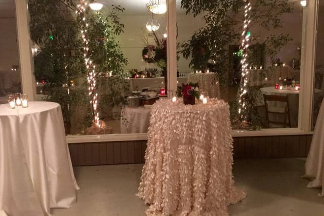 Elegant garden event space with soft lighting, perfect for weddings and receptions.