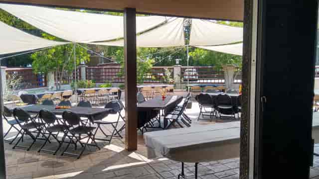 Patio at Prince of Peace Church, elegant outdoor event space with stylish canopies.